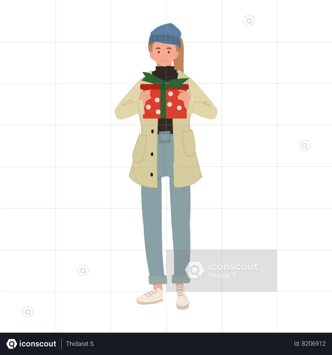Femme joyeuse appréciant les achats de Noël avec boîte-cadeau  Illustration