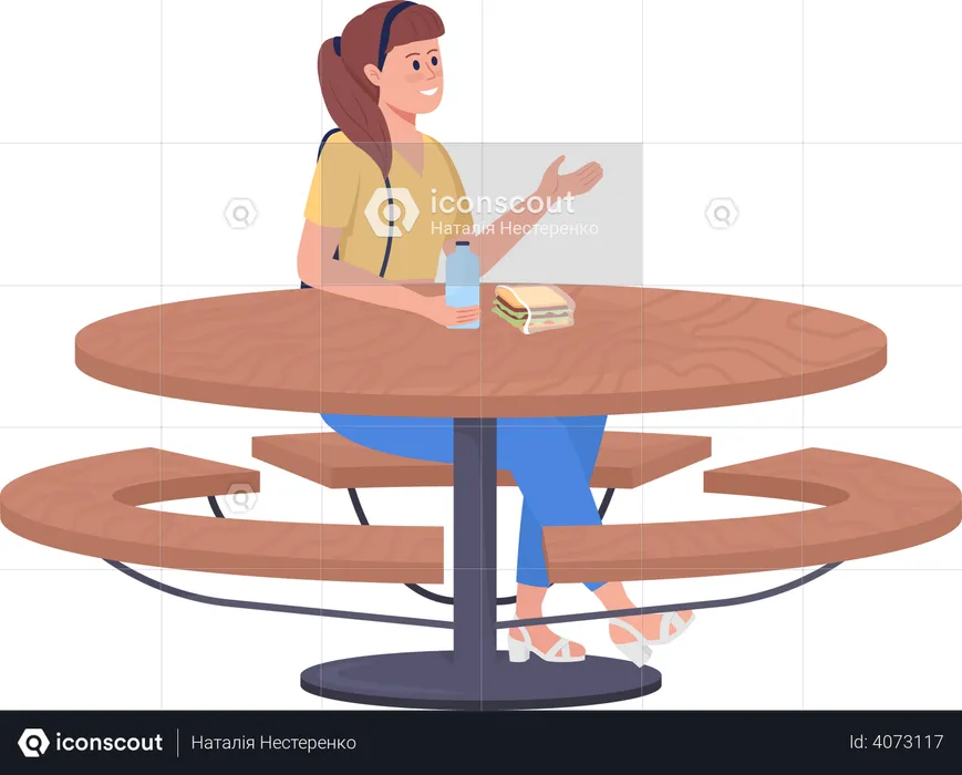 School girl sitting at table  Illustration