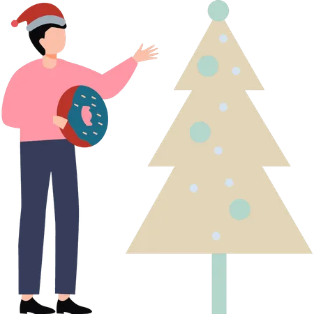 A Boy With A Donut Stands By A Christmas Tree Illustration