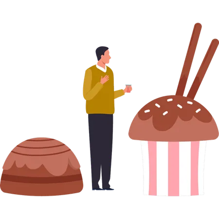 Boy is looking at chocolate cupcake  イラスト