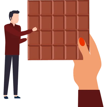 Boy Is Looking At The Chocolate Bar Illustration