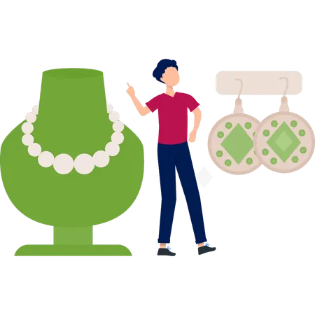 Boy is showing jewellery in shop  Illustration