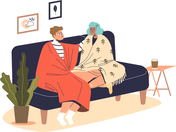 Jovem casal sentado no sofá coberto com cobertores quentes dentro de casa  Ilustração