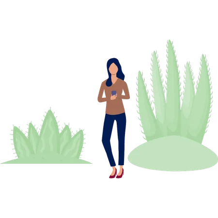 Chica usando un móvil cerca de una planta de cactus  Ilustración