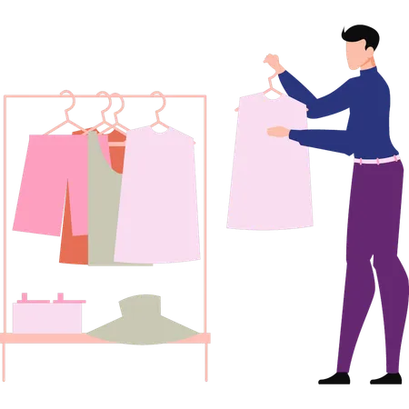 El hombre está revisando la ropa.  Illustration