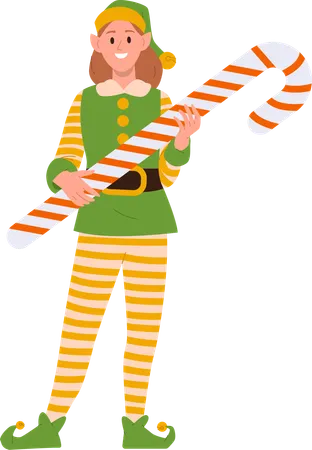 Feliz e sorridente garota elfa personagem ajudante de Papai Noel segurando bastão de doces doce e saborosa sobremesa de Natal  Ilustração