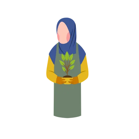 Une femme musulmane tient une plante  Illustration