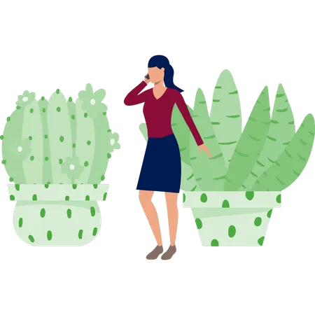 Femme occupée à appeler son portable près d'une plante de cactus  Illustration