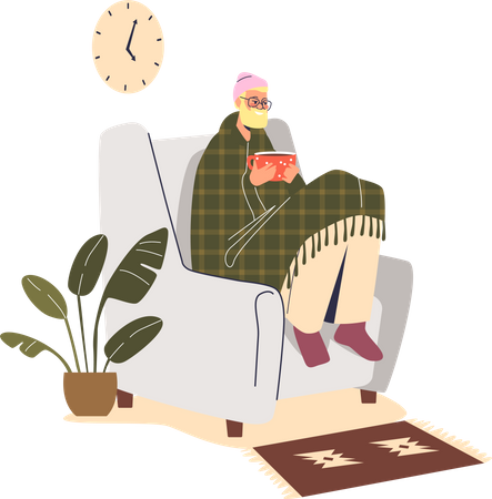 Freezing man sit in armchair at home under blanket wear hat indoors warming hands at hot cup  Illustration