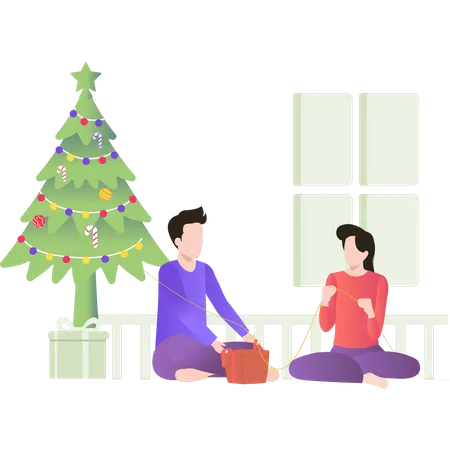 Garçon et fille emballant des cadeaux de Noël  Illustration