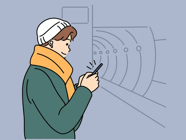 Un garçon musulman utilise un téléphone portable dans une station de métro  Illustration