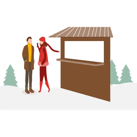 Girl and boy standing at the ticket counter Illustration