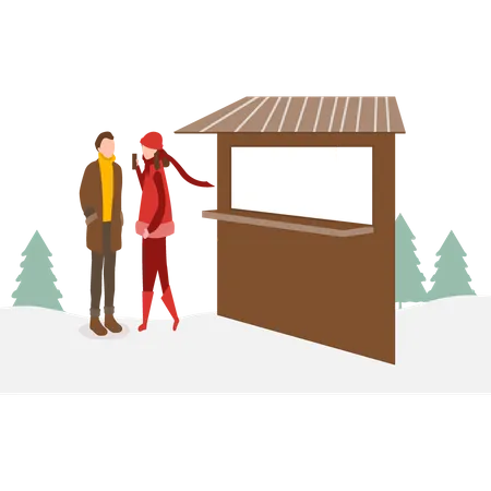 Girl and boy standing at the ticket counter  Illustration