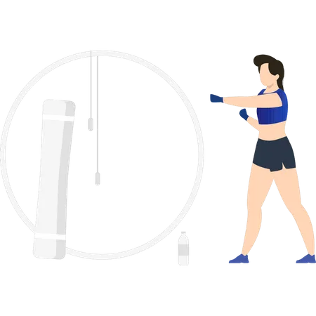 Girl exercising with punching bag Illustration