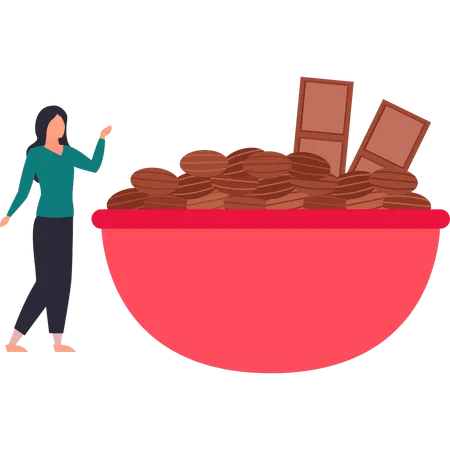 Girl is looking at a bowl of choco beans  Illustration