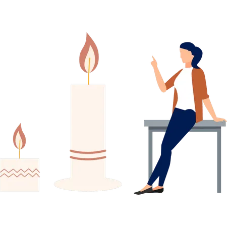 Girl sitting on table  pointing white candle  Illustration