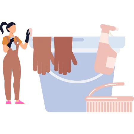 Girl standing next to cleaning bucket  Illustration