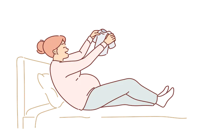 Happy Pregnant Woman Sits On Bed Holding Small T Shirt For Baby In Hands And Rejoices At Imminent Arrival Of Son Pregnant Girl Who Will Soon Become Mother And Prepares Clothes For Newborn In Advance Illustration