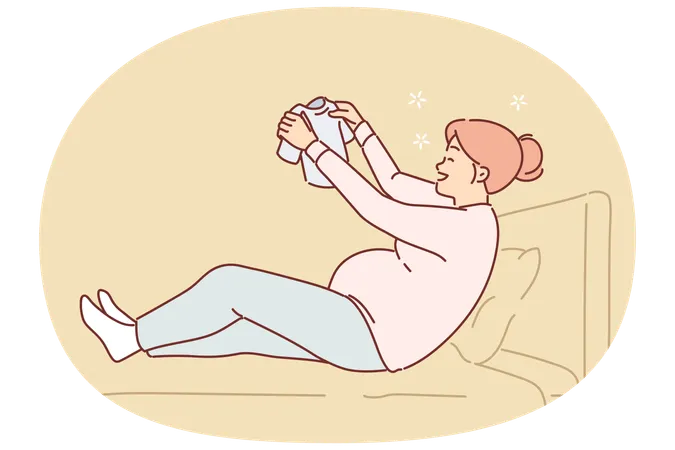 Happy pregnant woman sits on bed holding small t-shirt for baby in Hand  Illustration