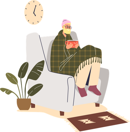 Homem congelando, sentado em uma poltrona em casa, sob o cobertor, usando chapéu dentro de casa, aquecendo as mãos em uma xícara quente  Ilustração