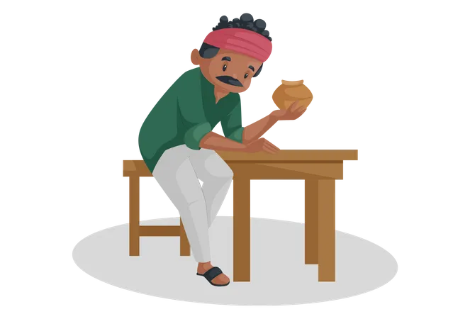 Indian potter is sitting on a table and holding an earthen pot in his hand  Illustration