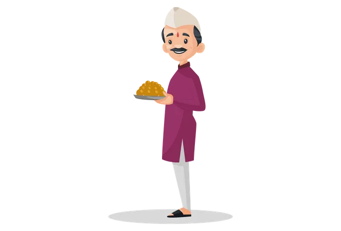 Homme indien marathi tenant une assiette de bonbons dans ses mains  Illustration
