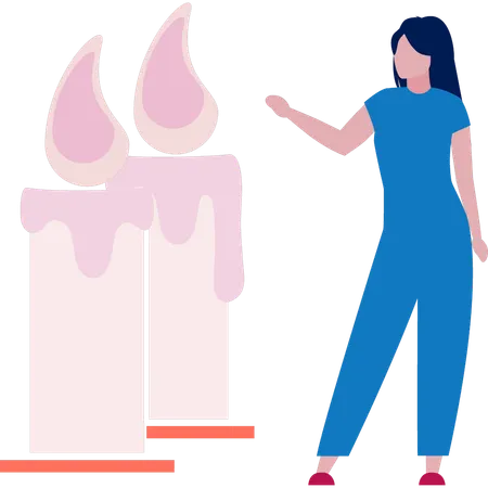 Jovem senhora está apontando para uma vela acesa  Ilustração