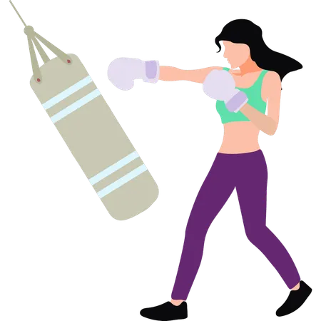 La fille frappe le sac de boxe  Illustration