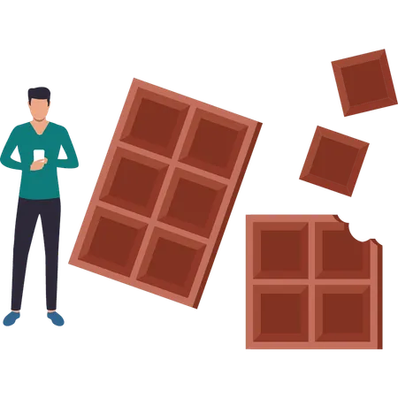 Le chocolat, c'est manger une barre de chocolat et surfer sur son téléphone  Illustration
