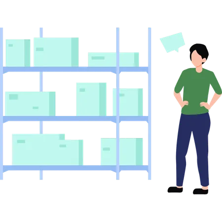 Le garçon regarde les boîtes de rangement sur l'étagère  Illustration