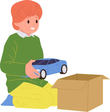 Lindo niño pequeño empacando un auto de juguete en una caja de cartón antes de mudarse  Ilustración