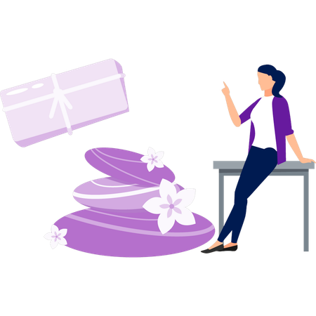 Mädchen sitzt auf dem Tisch und zeigt Geschenkbox  Illustration