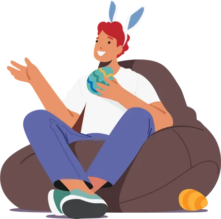 Young Man In Rabbit Ears Holding Decorated Egg For Easter Holiday Celebration Sitting On Bean Bag Isolated On White Background Male Character Prepare For Fun Cartoon People Vector Illustration Illustration