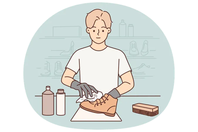Man shoemaker cleans client leather boots after repair working in professional shoe shop  Illustration