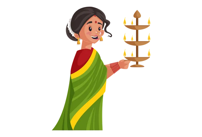 Marathi woman is holding brass aarti lamp in her hands  Illustration