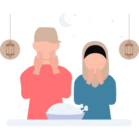 Menino e menina estão rezando antes de comer  Ilustração