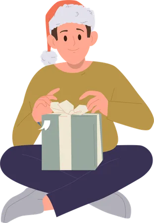 Menino usando chapéu festivo de Natal abrindo caixa de presente embrulhada  Ilustração