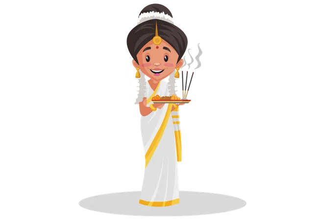 Mujer india malayali sosteniendo un plato de adoración en sus manos  Ilustración
