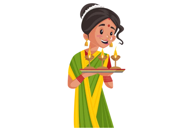 La mujer india marathi sostiene el plato de Diyas en la mano  Ilustración