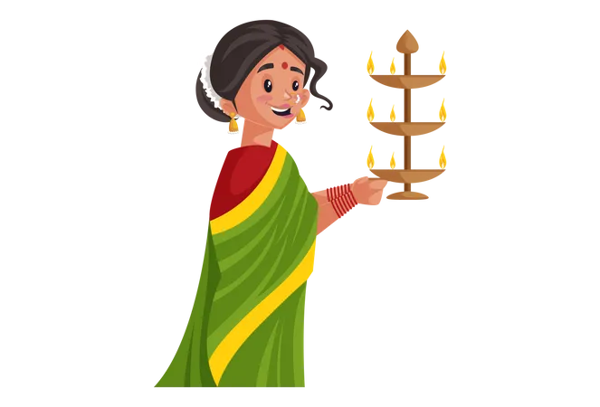 Mulher Marathi está segurando uma lâmpada de latão aarti nas mãos  Ilustração