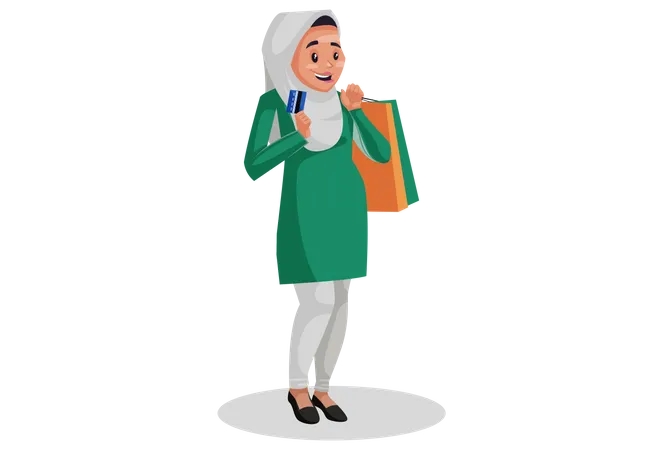 Muslimische Frau hält Einkaufstüten und Bankkarte in den Händen, um online zu bezahlen  Illustration