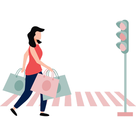 La chica cruza la calle con bolsas de compras en la mano  Ilustración