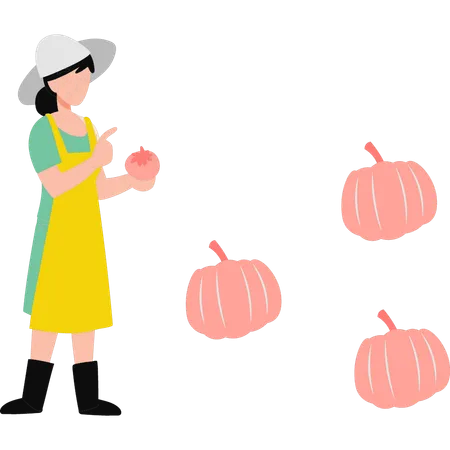 Niña de pie junto a la calabaza  Ilustración