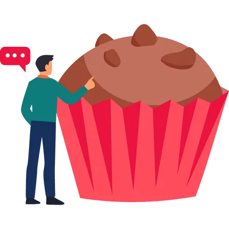 El chico apunta a un cupcake de chocolate con envoltorio rojo  Ilustración