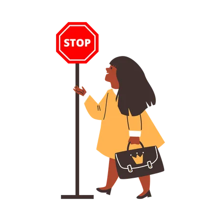 Une petite fille regarde un panneau d'arrêt  Illustration
