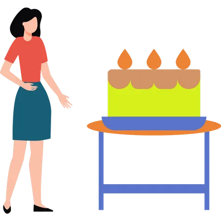 The girl is looking at the cake  イラスト