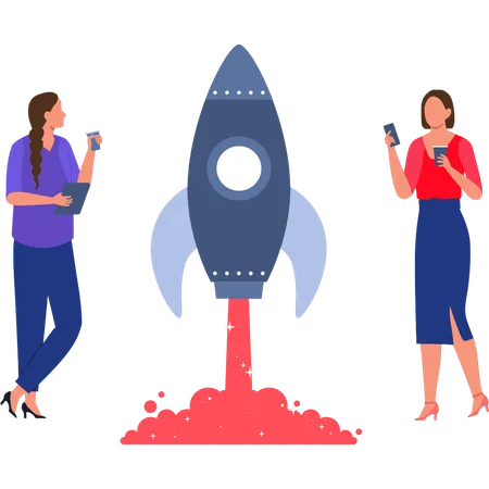 The girls are standing next to the rocket.  Illustration