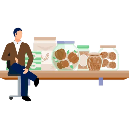 The man is sitting on chair and seeing bakery items  Illustration