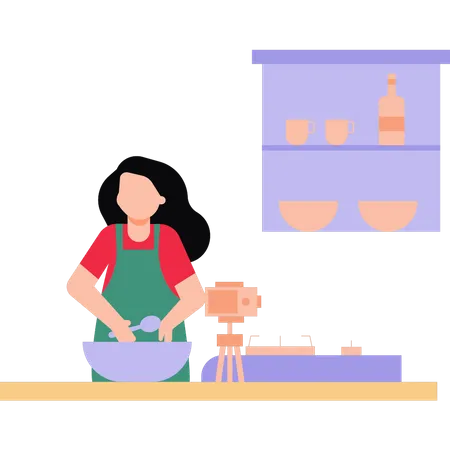 Una chica está haciendo un vídeo de cocina.  Ilustración