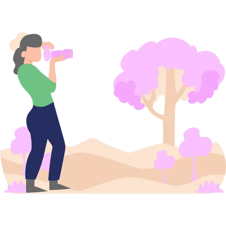 Woman photographer is taking pictures of nature  イラスト